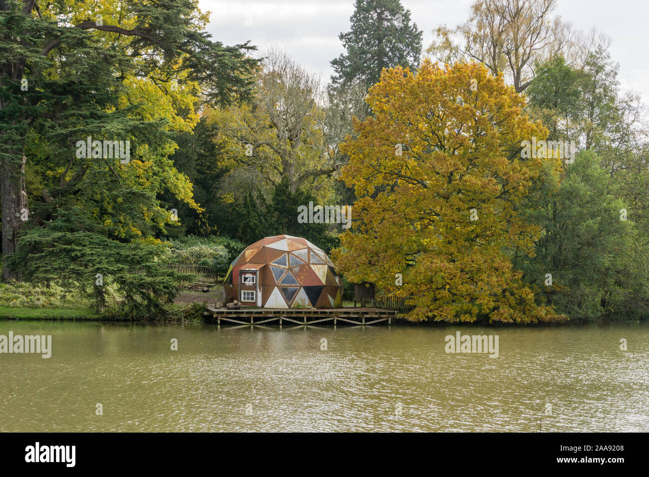 The Clearing, a geodesic dome, on the edge of the lake at Compton Verney, Warwickshire, UK; volunteers occupy it to experience green living Stock Photo