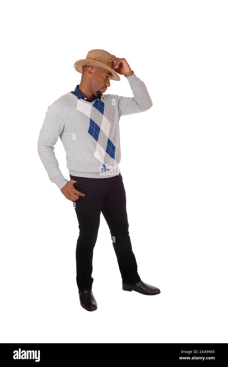 A handsome young African American man standing with his thumps up in a sweater and cowboy hat, isolated for white background Stock Photo
