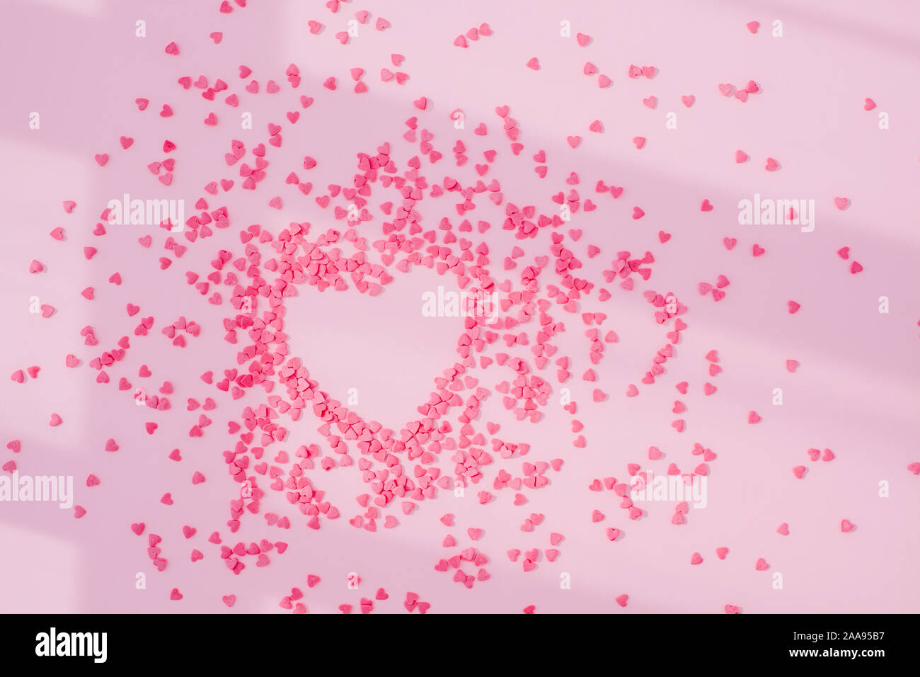 Pink Heart Window Pink heart from small hearts on the pink background with shadows from ...