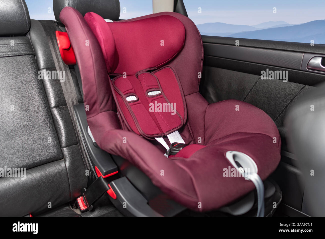 Children's car seat in the car. Stock Photo