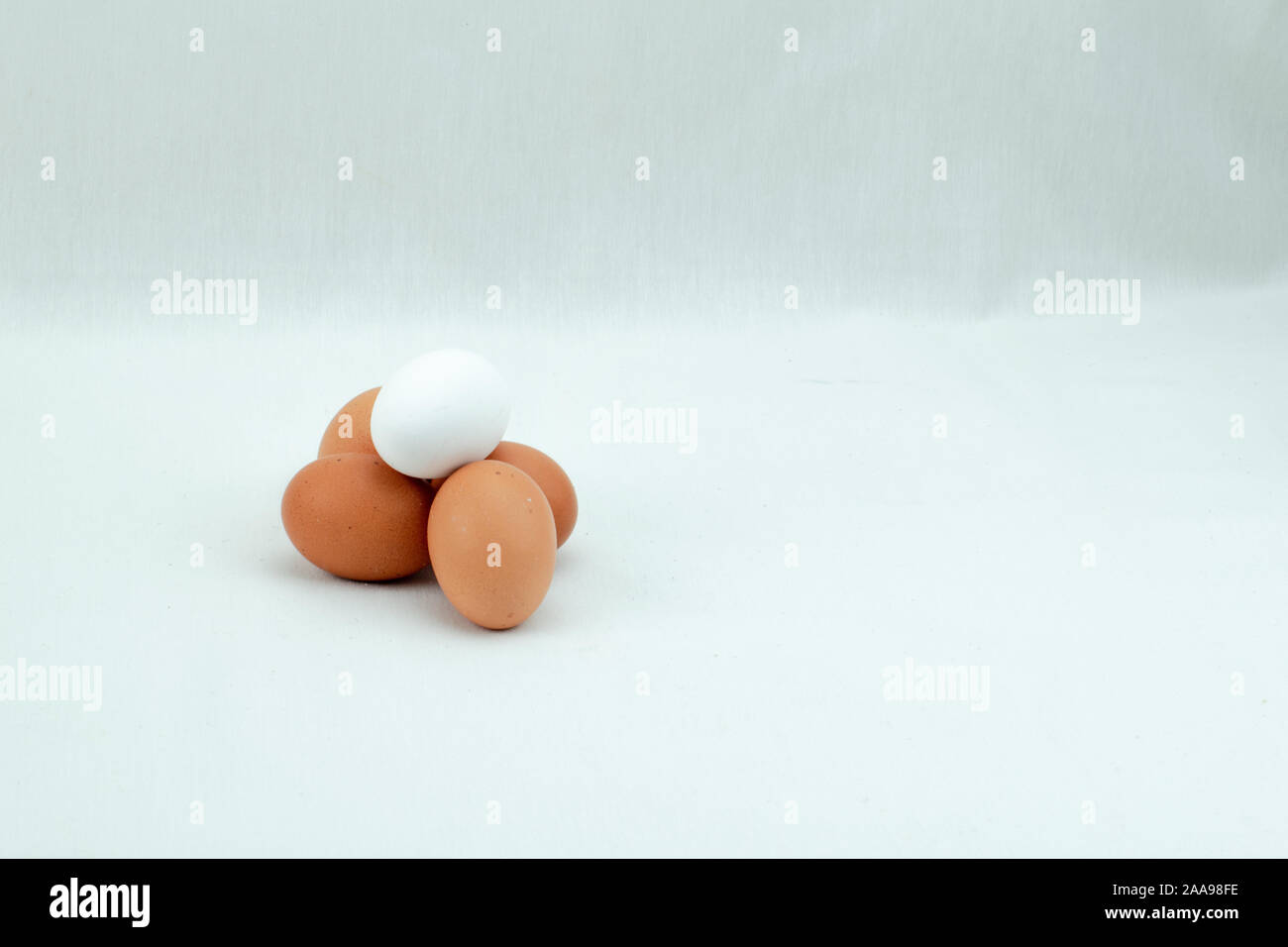 four red eggs and one white Stock Photo Alamy