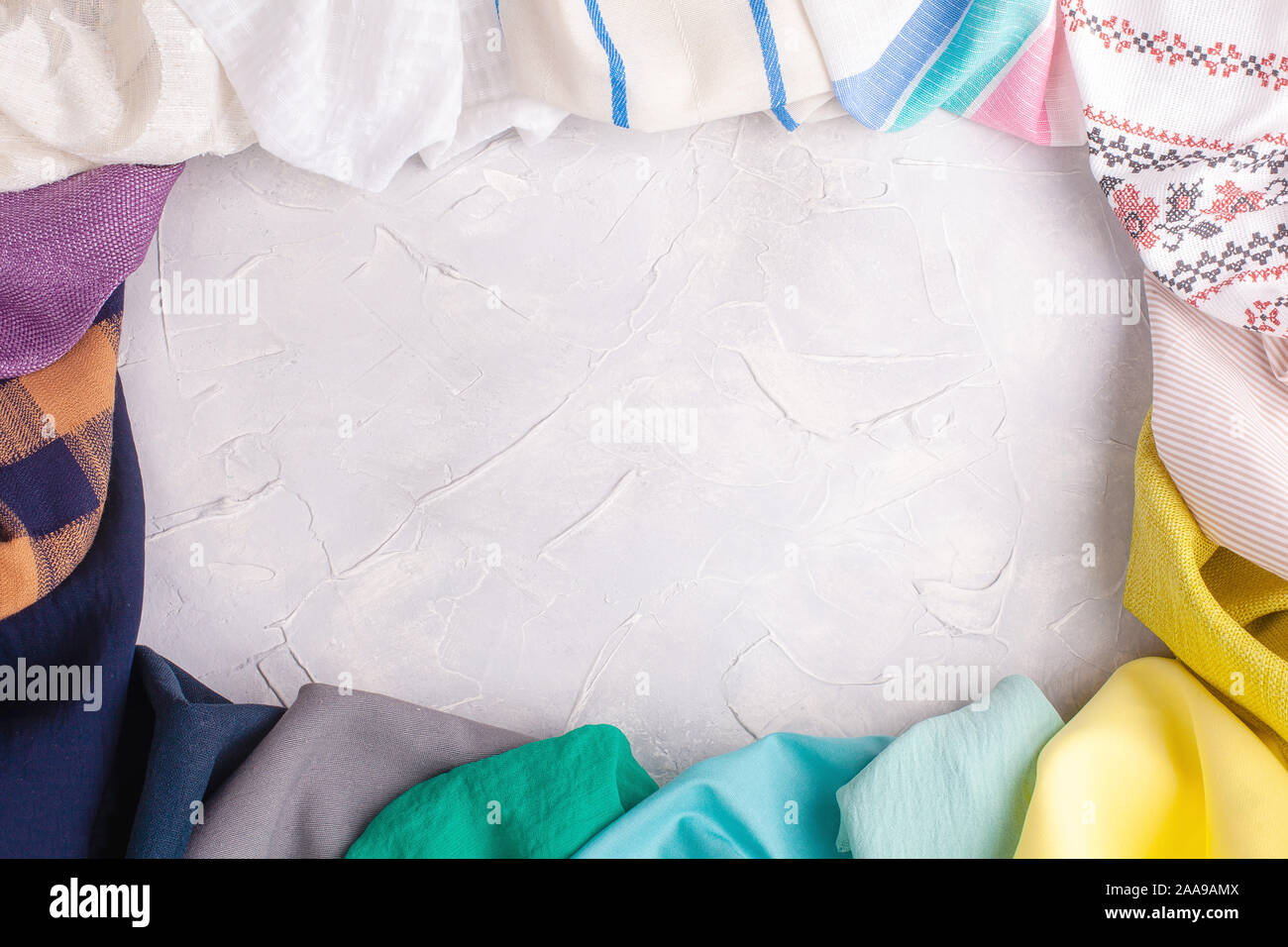 Fabric multi-colored frame on grey background Stock Photo - Alamy