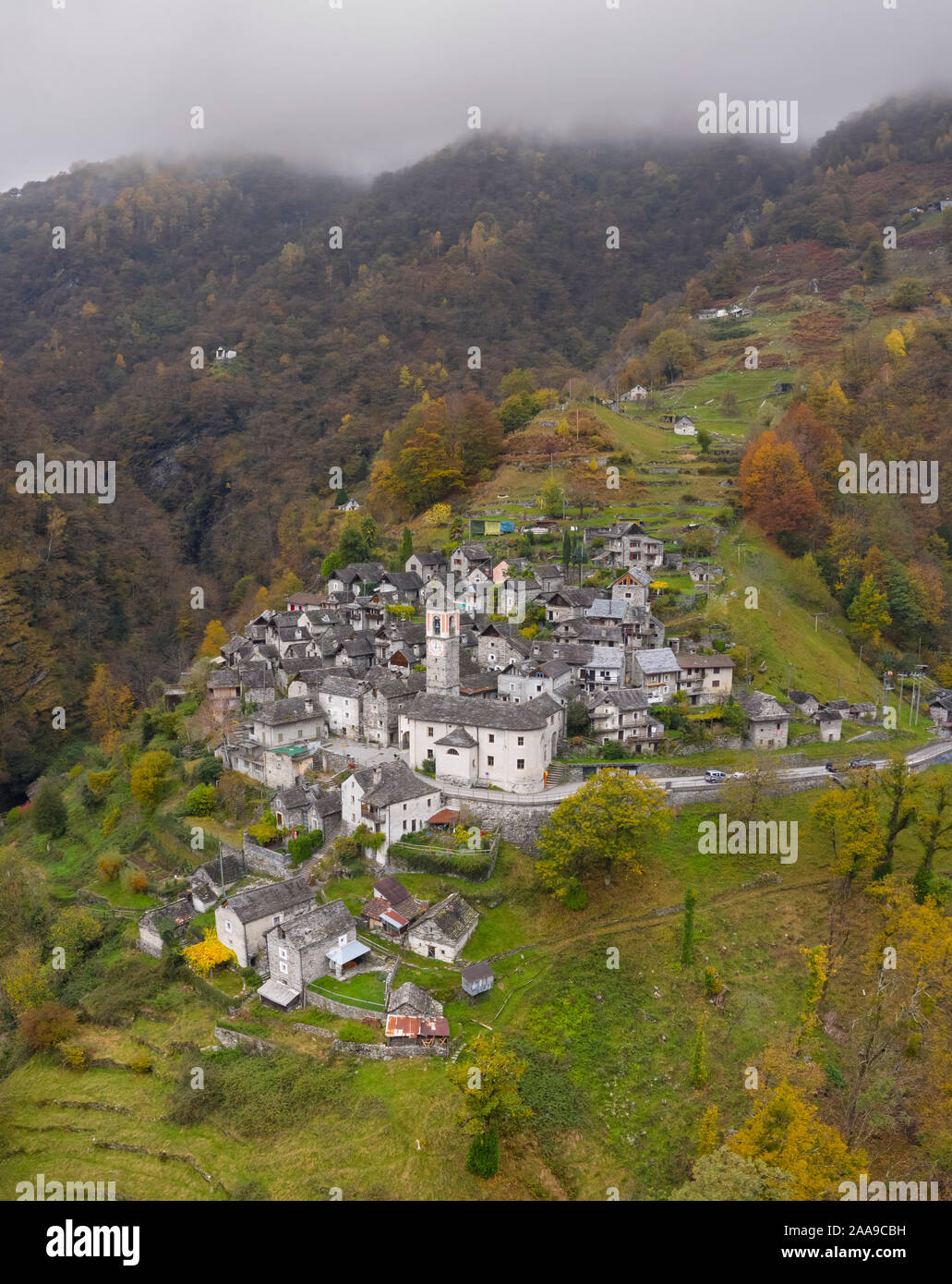Autumnal view of the town of Corippo, the town with less inhabitants of all Switzerland. Corippo, Valle Verzasca, Canton Ticino, Switzerland. Stock Photo