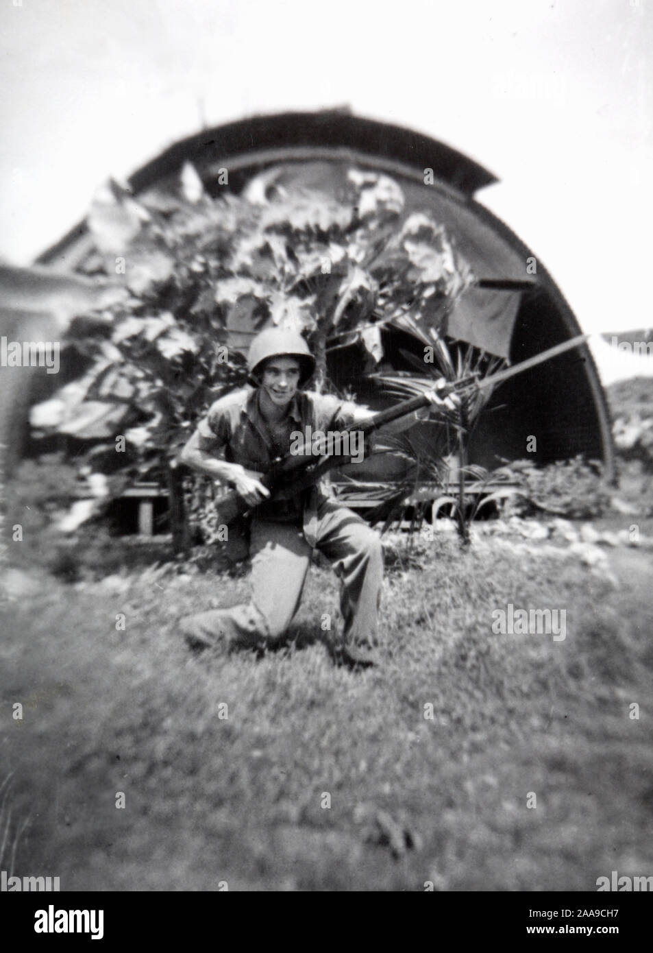 A Navy Seabee show off his rifle skills on Guam, ca. 1944. Stock Photo