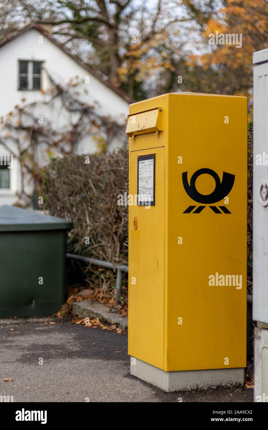 Deutsche Post Mailbox. The Deutsche Post AG, operating under the name Deutsche Post DHL Group, is a German postal service and international courier. Stock Photo