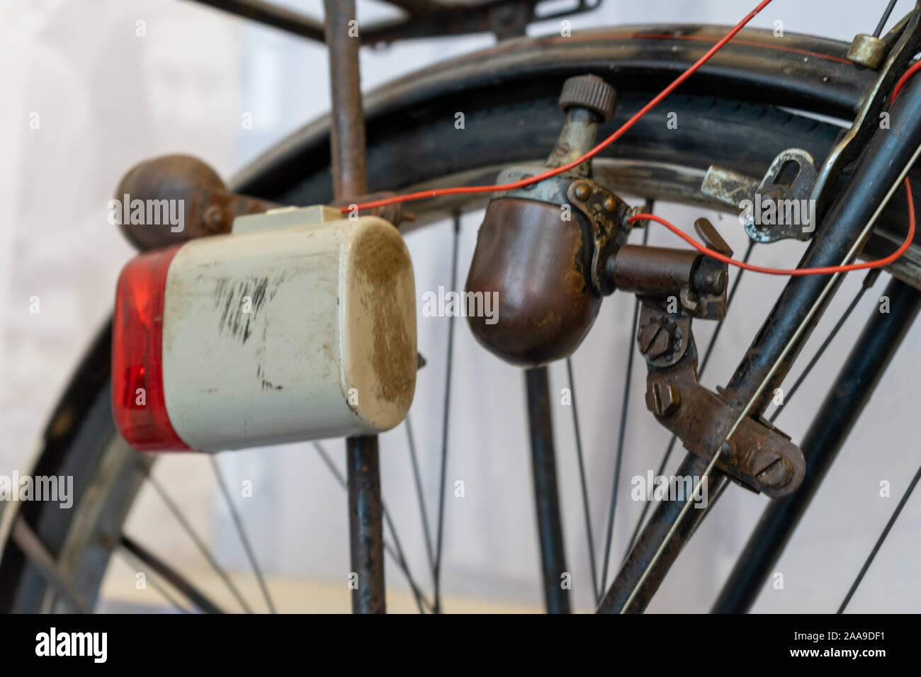 An old bike or bicycle dynamo system used to generate power to illuminate a lights Stock Photo