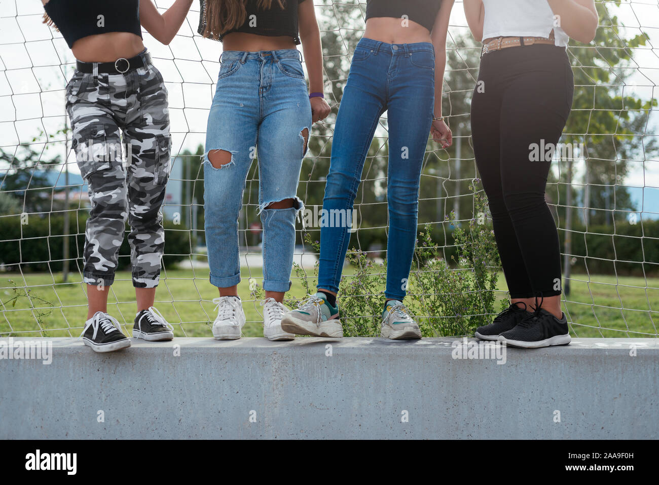 Close up of four teenage girls legs Stock Photo