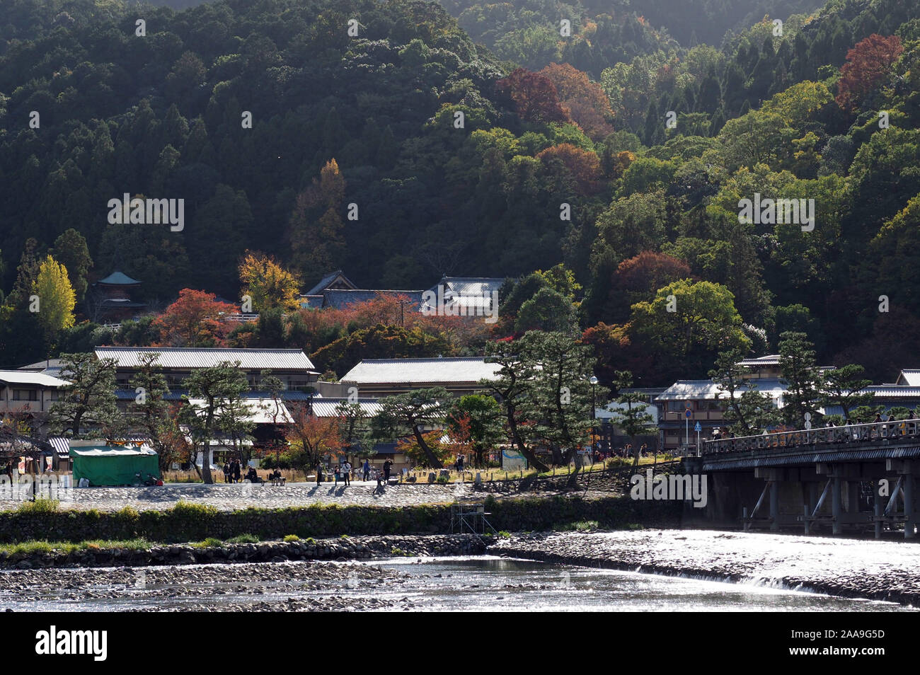 Fall foliage and colors across from the Togetsu-kyo Bridge in Arashiyama, Kyoto, Japan. Stock Photo