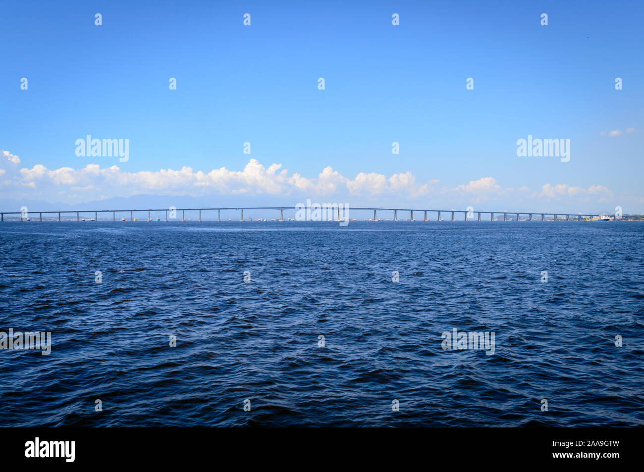 Ocean view of Rio–Niterói Bridge on a sunny day with blue skies. Stock Photo