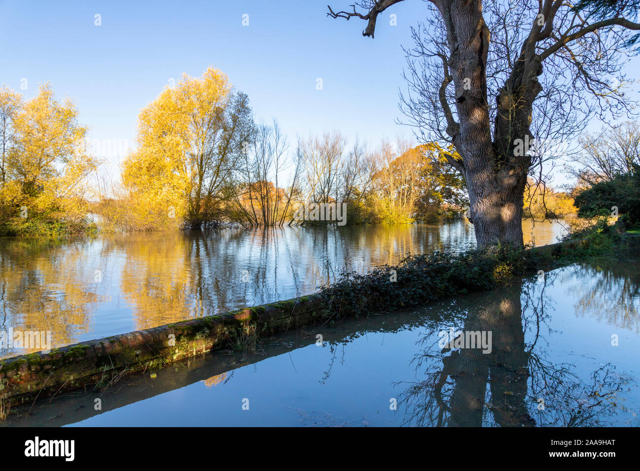 Floodwater from the River Severn coming up to the churchyard wall in the Severn Vale village of Deerhurst, Gloucestershire UK on 18/11/2019 Stock Photo