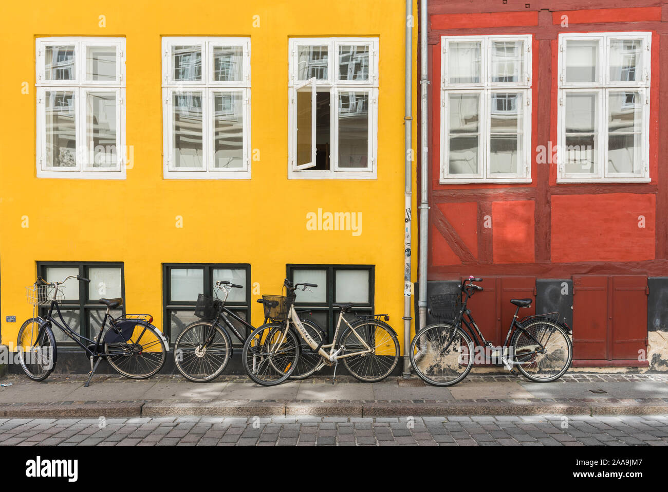 Denmark bicycle, view of bicycles parked against colorful period buildings in the Old Town district of central Copenhagen, Denmark. Stock Photo