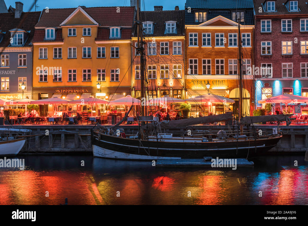 Nyhavn Copenhagen, evening view of the waterfront area of bars and restaurants in Nyhavn in the central harbor district of Copenhagen, Denmark. Stock Photo