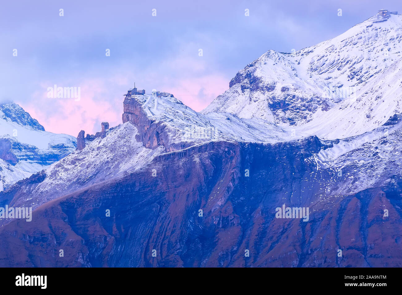 Panoramic view of Swiss Alps, Jungfraujoch region, pink sunrise, Schilthorn peak, Bernese Oberland, Switzerland Stock Photo