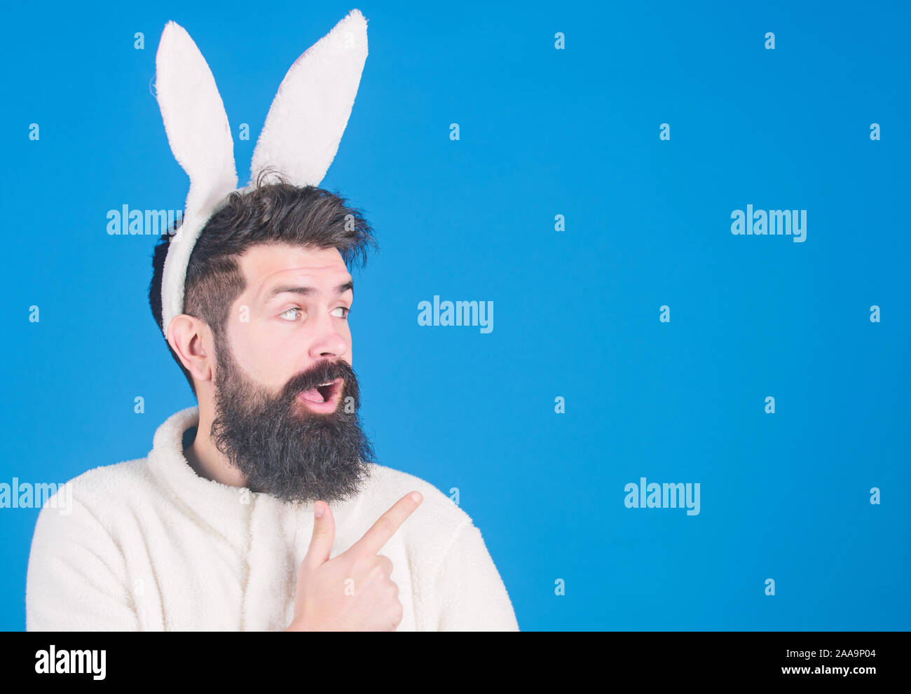How about that. Bearded man in Easter rabbit costume pointing finger at ...