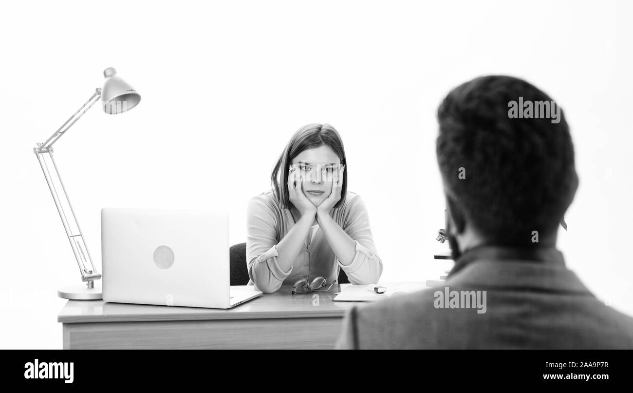 Fully engaged. Man applying for job. Human resource manager conducting job interview. Female boss making decision about job applicant. Pretty interviewer talking with job candidate in HR department. Stock Photo