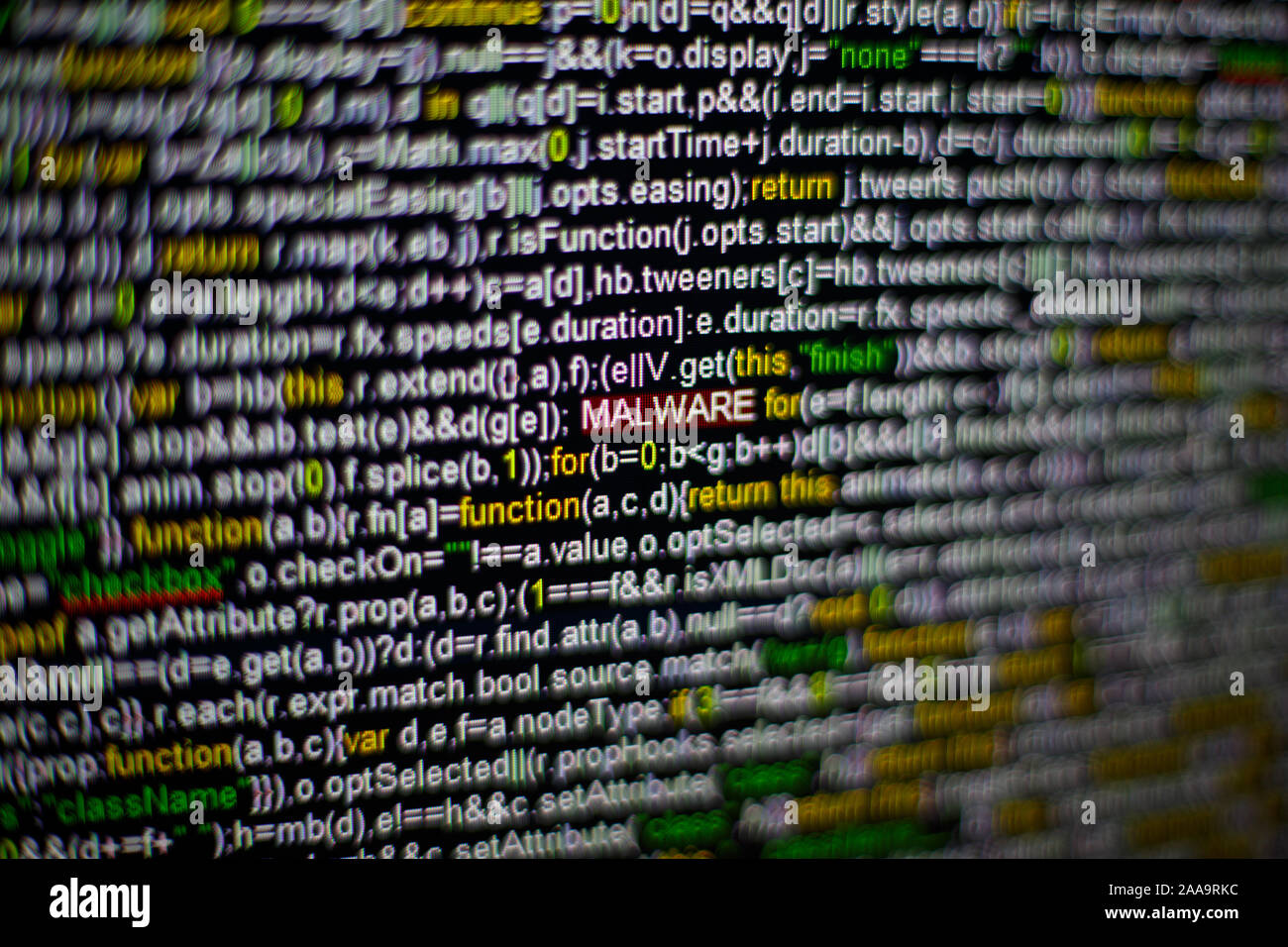 Macro photo of computer screen with program source code and highlighted ...