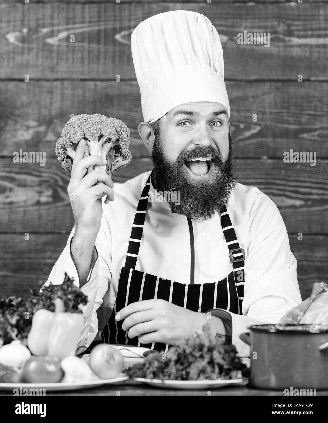 This should be fine. Vegetarian salad with fresh vegetables. Cuisine culinary. Vitamin. Happy bearded man. chef recipe. Dieting organic food. Healthy food cooking. Mature hipster with beard. Stock Photo