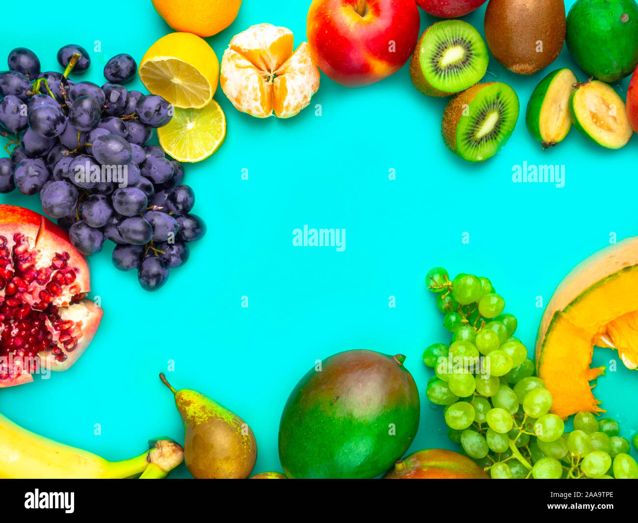 Fruits and vegetables rich in antioxidants, vitamin and fiber on blue