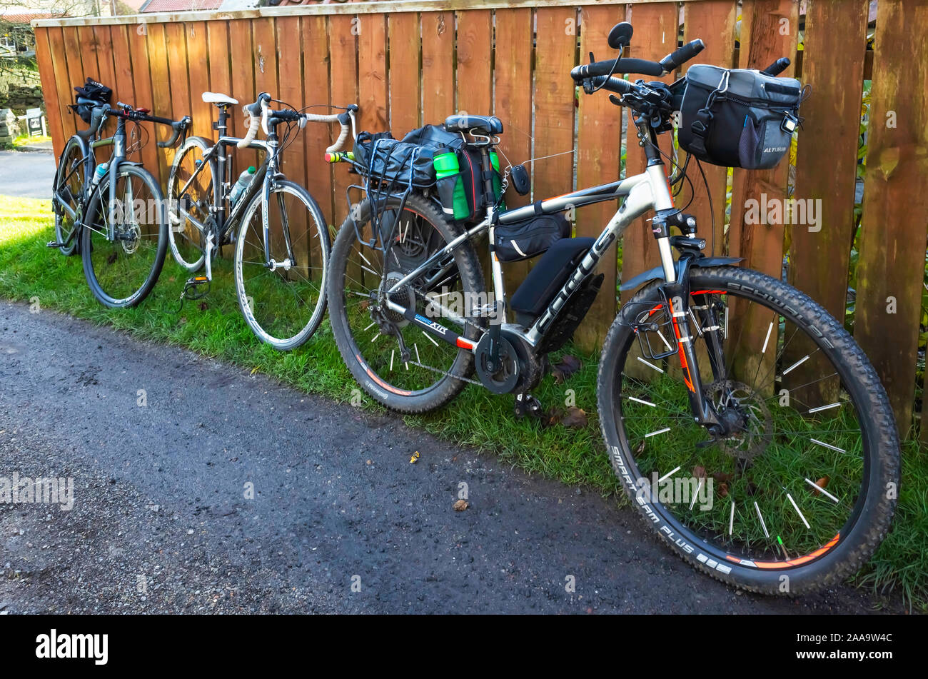 High quality touring bicycles parked while the riders are in a nearby Danby café. North Yorkshire Moors Stock Photo