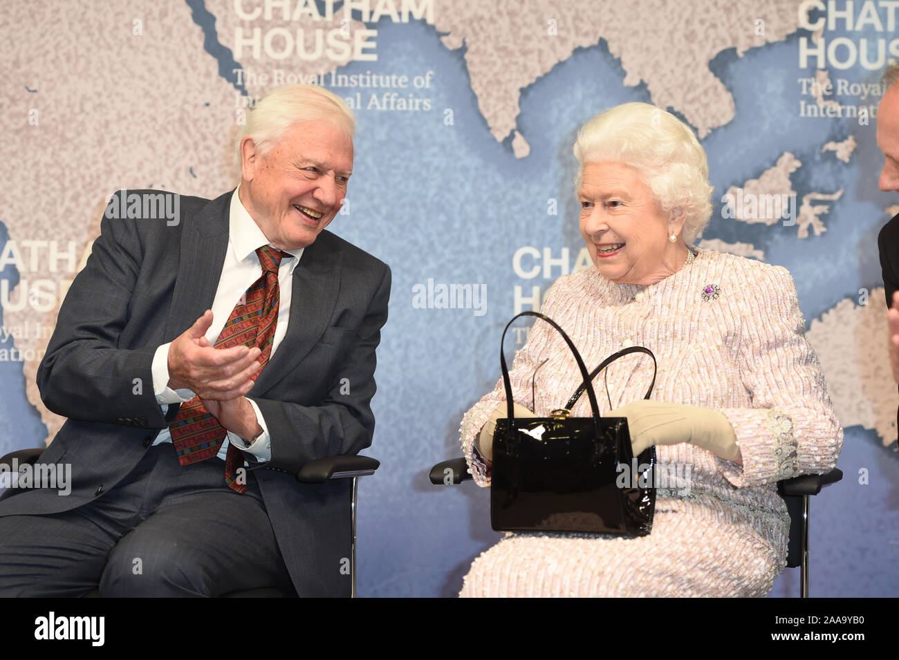 Queen Elizabeth II alongside Sir David Attenborough at the Royal institute of International Affairs, Chatham House, London, where she presented the Chatham House Prize 2019 to the 93-year-old broadcaster and Julian Hector, Head of the BBC Natural History Unit. Stock Photo