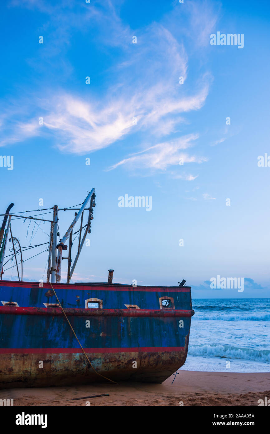 A beached trawler at St Andrew's beach, Trivandrum Stock Photo
