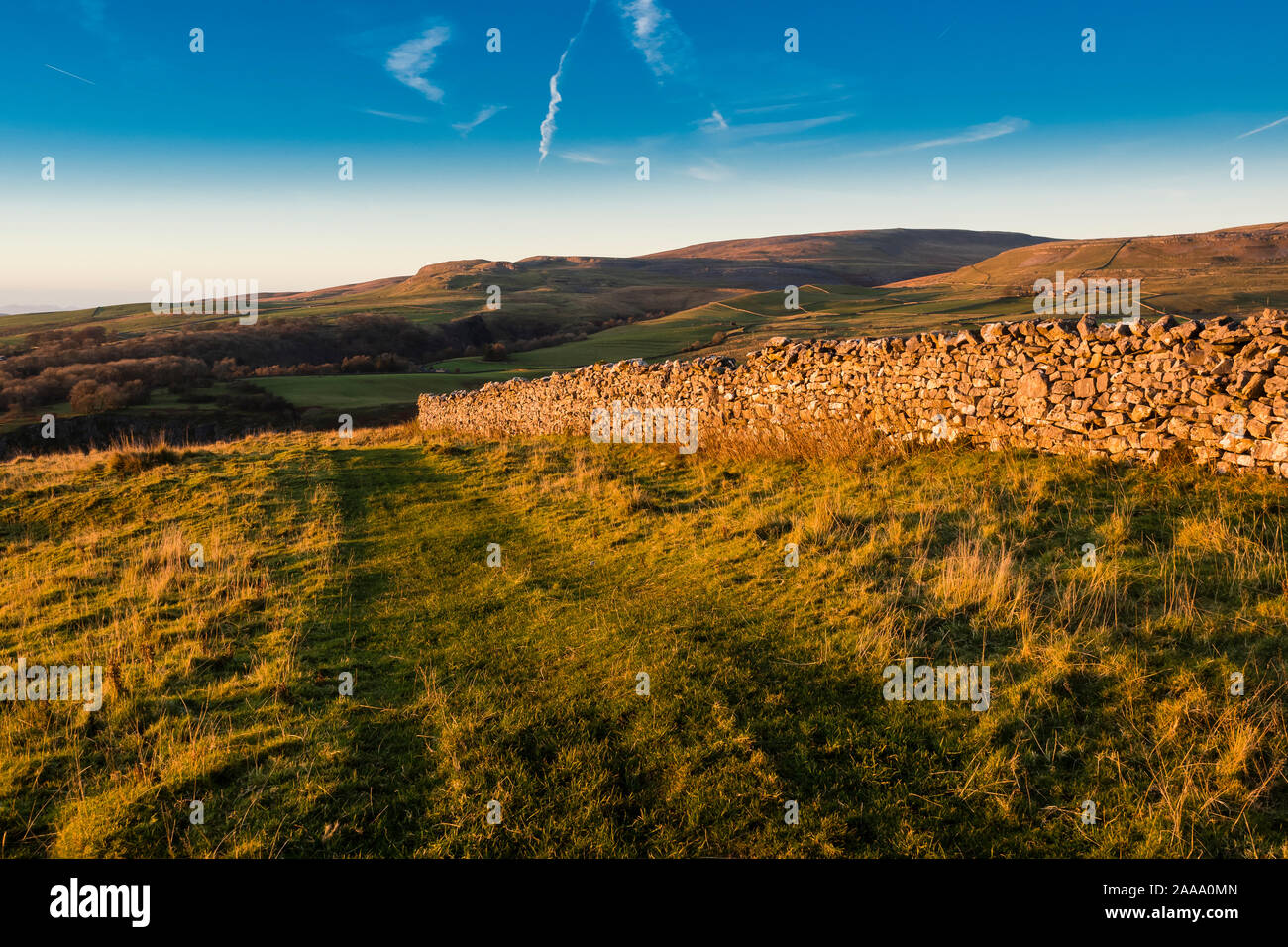 Thw White Scars above Ingleton with Whernside and Ingleborough in the background Stock Photo