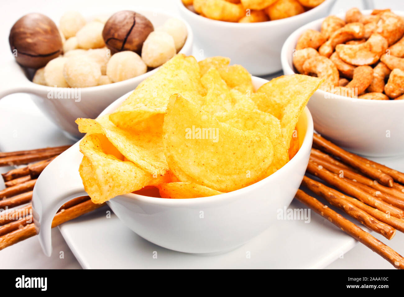 Various snacks with chips and nuts Stock Photo Alamy