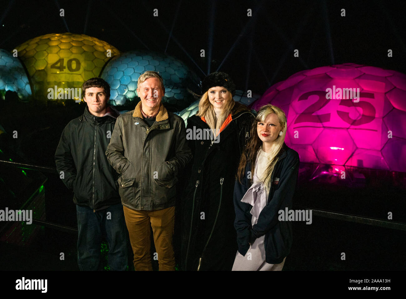 Peter Stewart, Eden Project Director of Outreach and Development, Activist and actress Lily Cole with Jordan Endean and Brogan Cawley from the Game Changer initiative look on as the biomes are turned into giant illuminated lottery balls to launch the National Lottery???s ???Thanks to You??? campaign, which celebrates 25 years of the lottery and the more than 40 billion pounds that has been raised for good causes since the first draw. Stock Photo