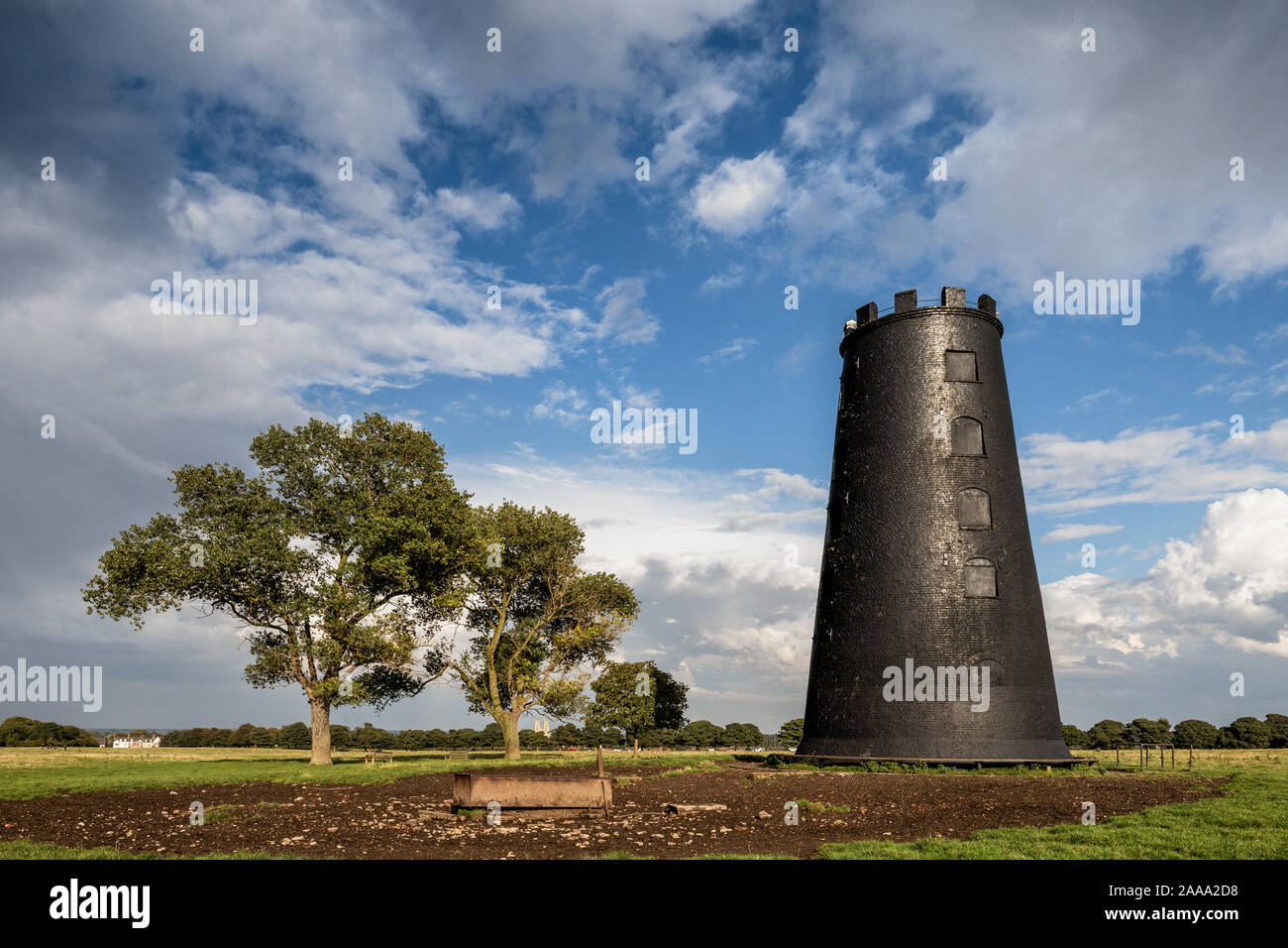The Black Mill, an old brick windmill painted with black tar with no sails, is a landmark on Beverley Westwood, Beverley, East Yorkshire, England Stock Photo