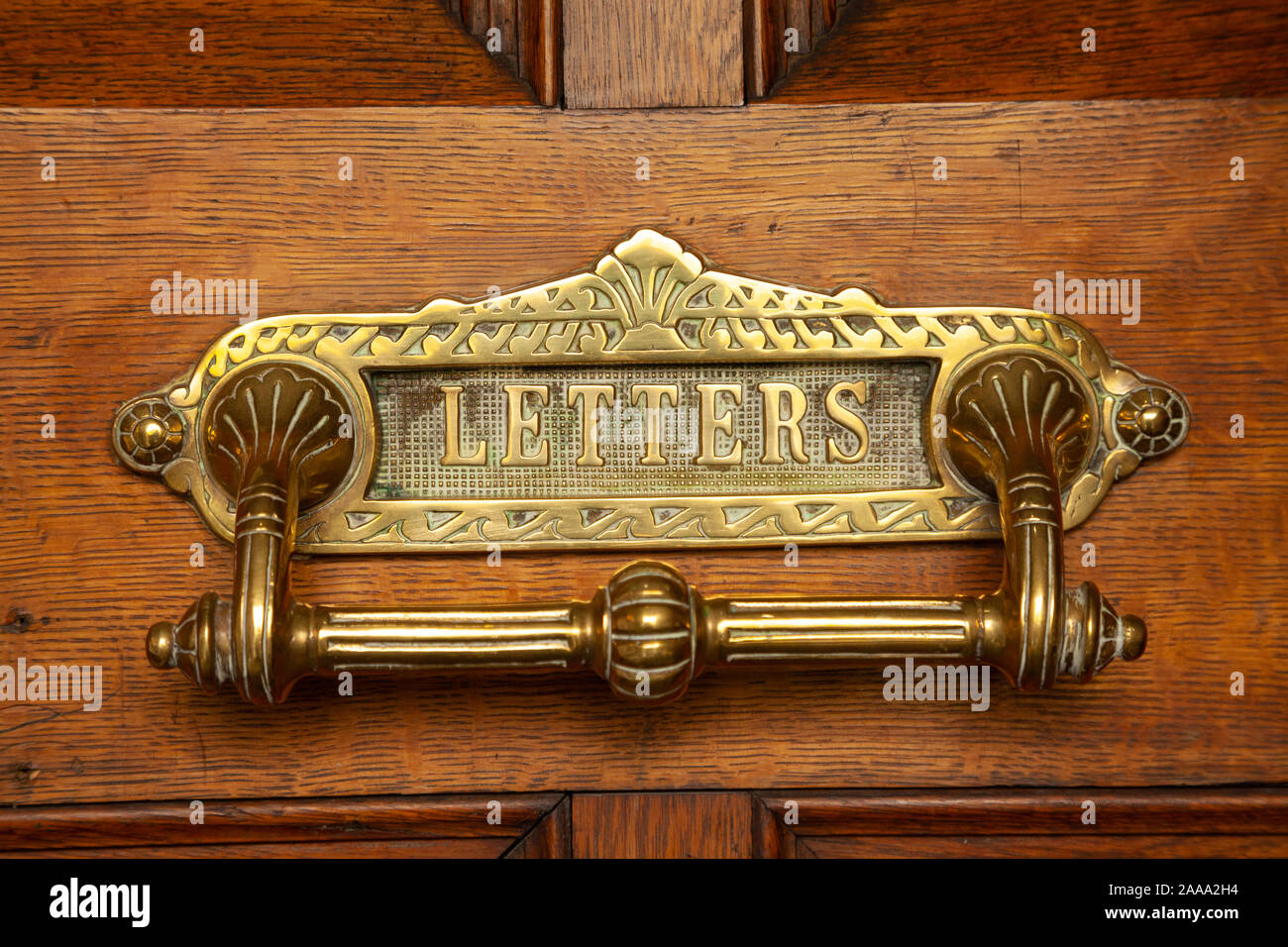 Close up of an old letterbox on an old wooden Stock Photo