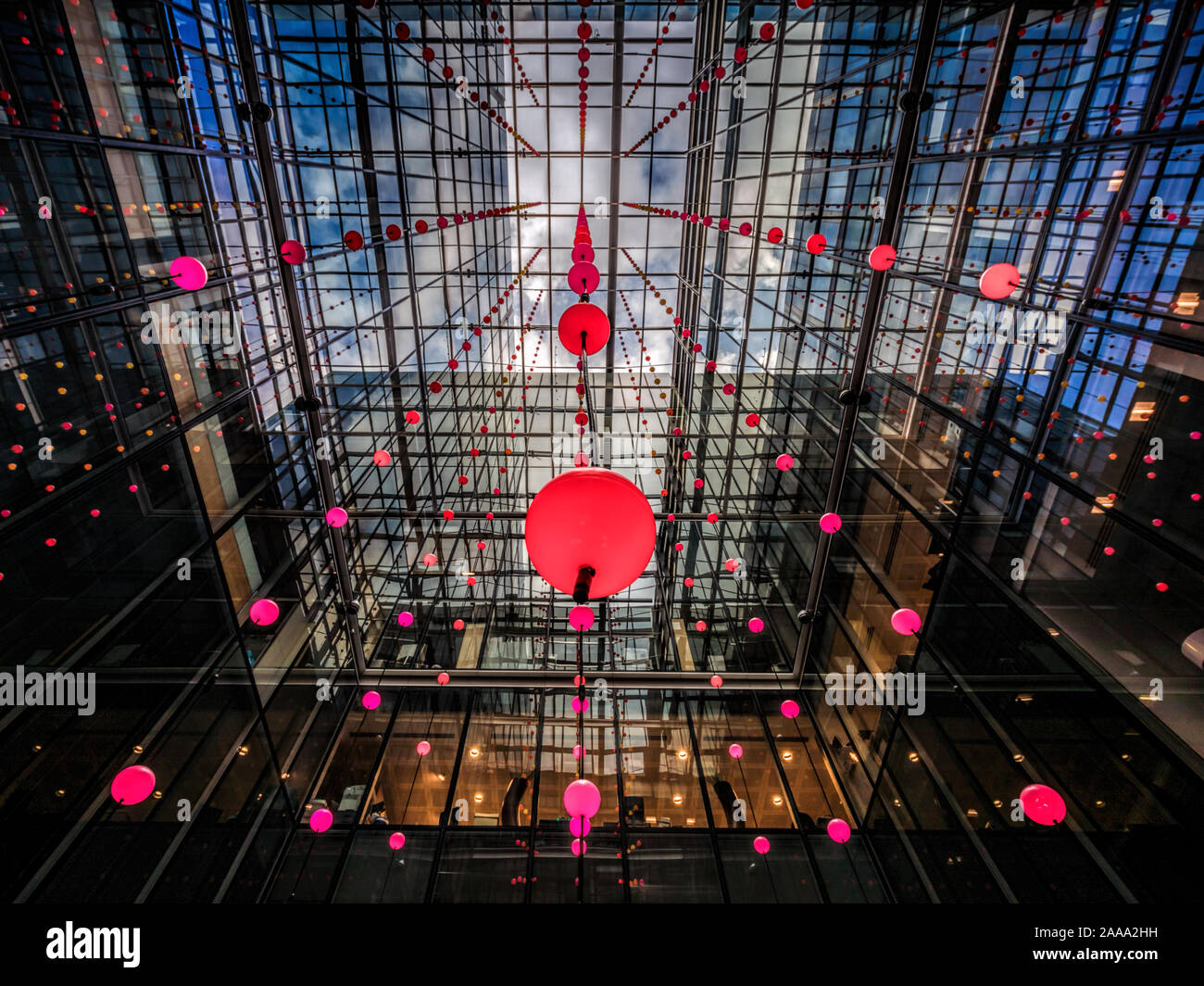 'Pixel Cloud' installation by Daniel Hirchmann. Luminescent spheres suspended in an atrium inside an office building, One Bishops Square, London. UK Stock Photo
