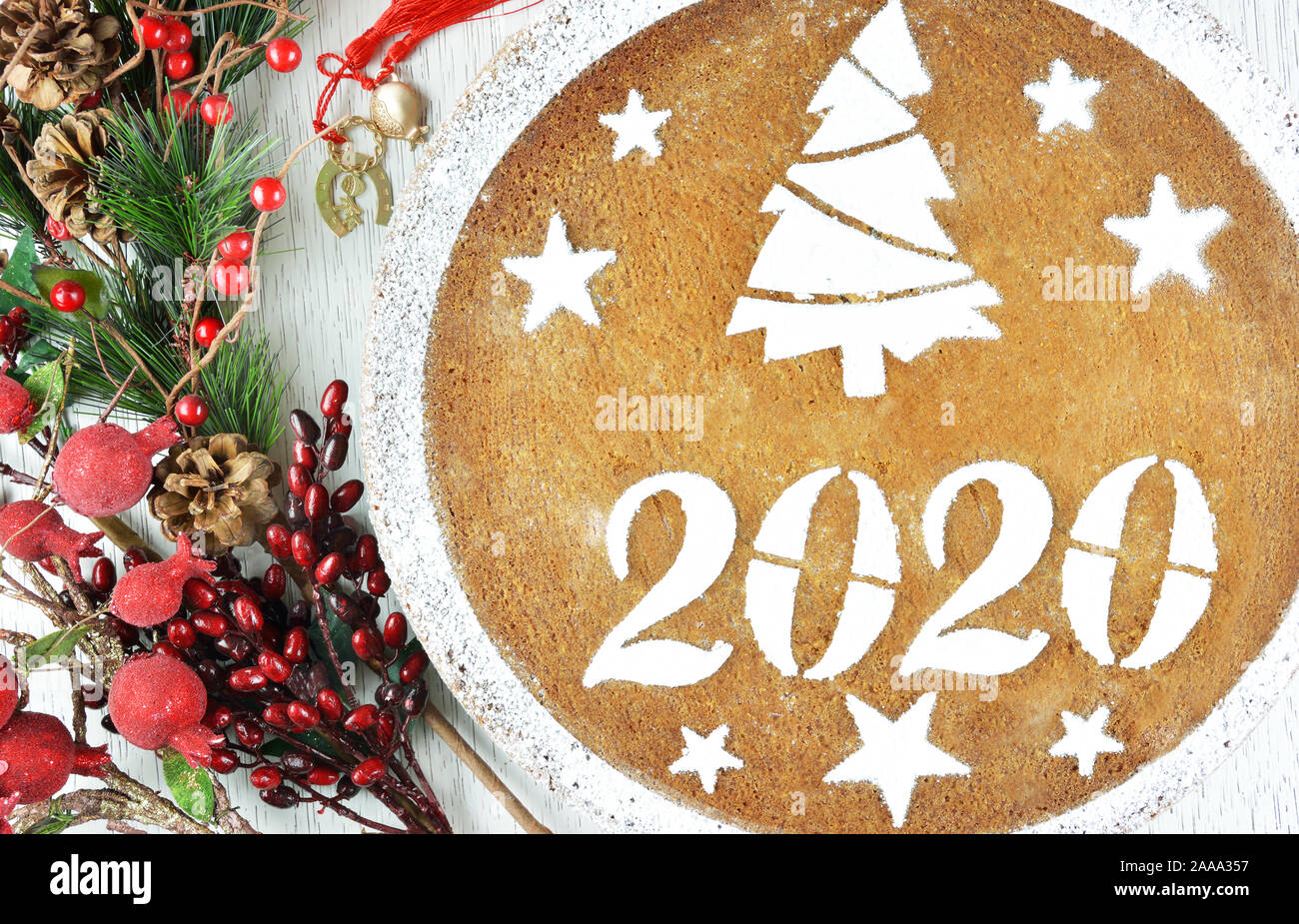 greek christmas 2020 Traditional Greek New Year S Cake Known As Vasilopita For 2020 Lucky Charms With Red Tassels And Artificial Pine And Red Berries Sticks Stock Photo Alamy greek christmas 2020
