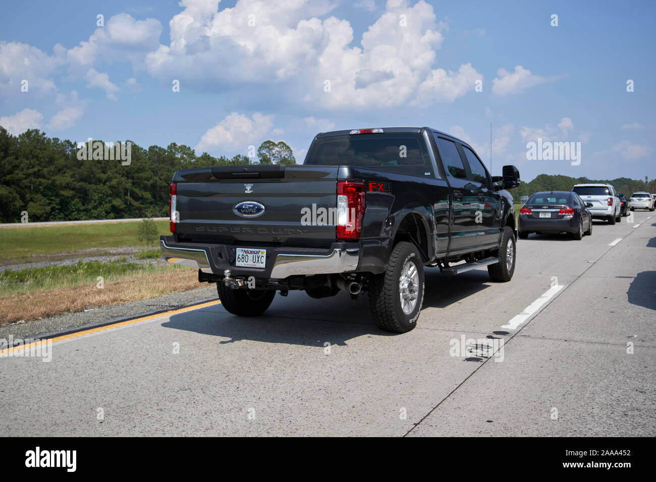 ford super duty truck in outside lane of traffic backed up driving along interstate 16 jim gillis historic savannah parkway in southern georgia usa Stock Photo