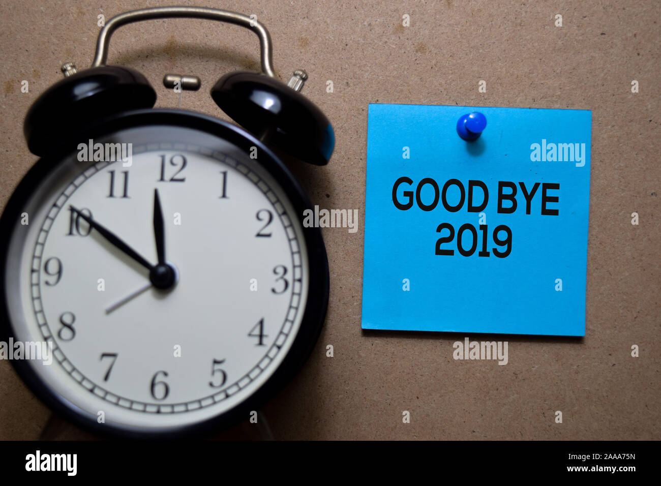 Good Bye 2019 write on sticky note. Isolated on Wooden Table Stock Photo