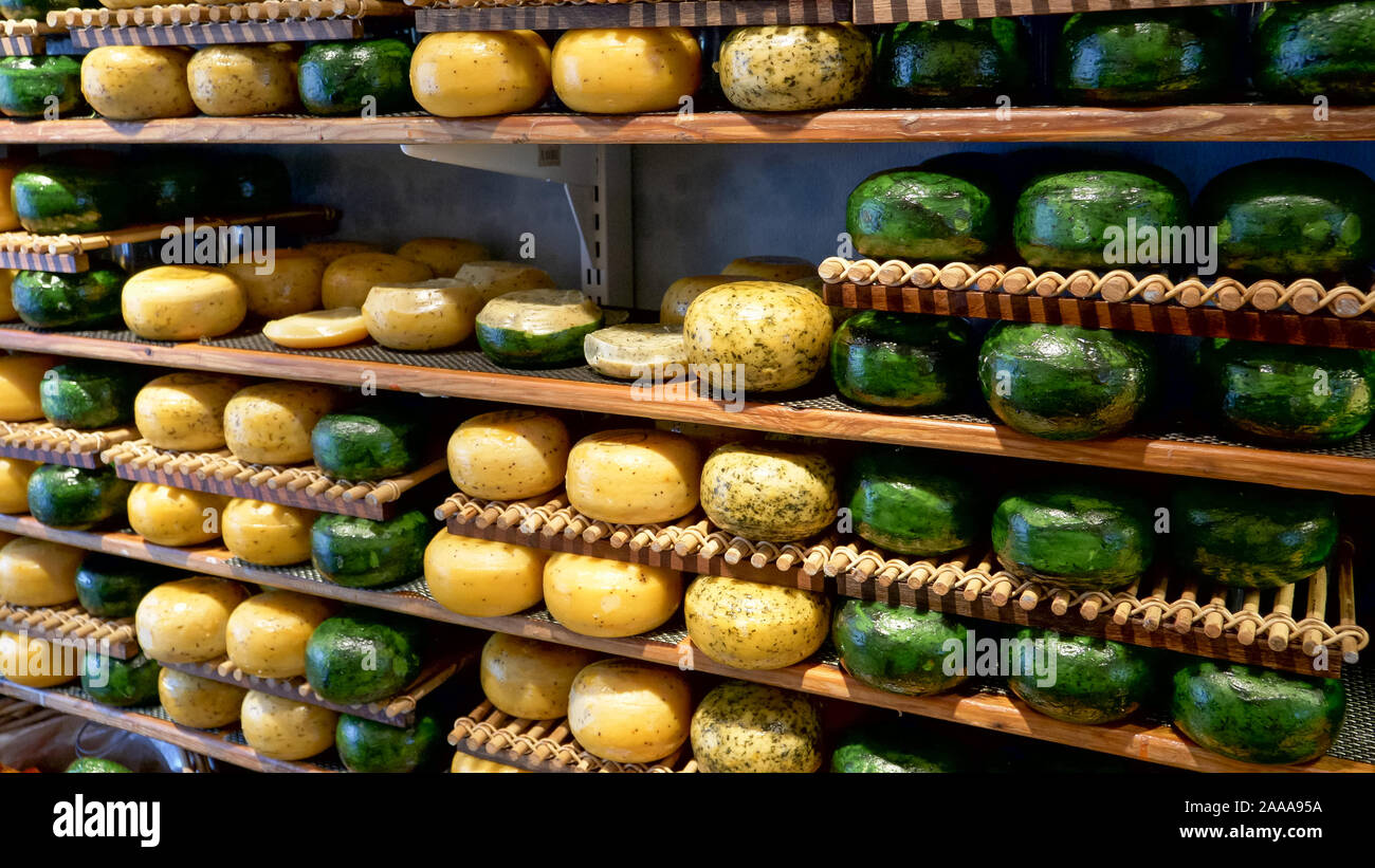 yellow and green gouda cheese wheels in an amsterdam shop Stock Photo