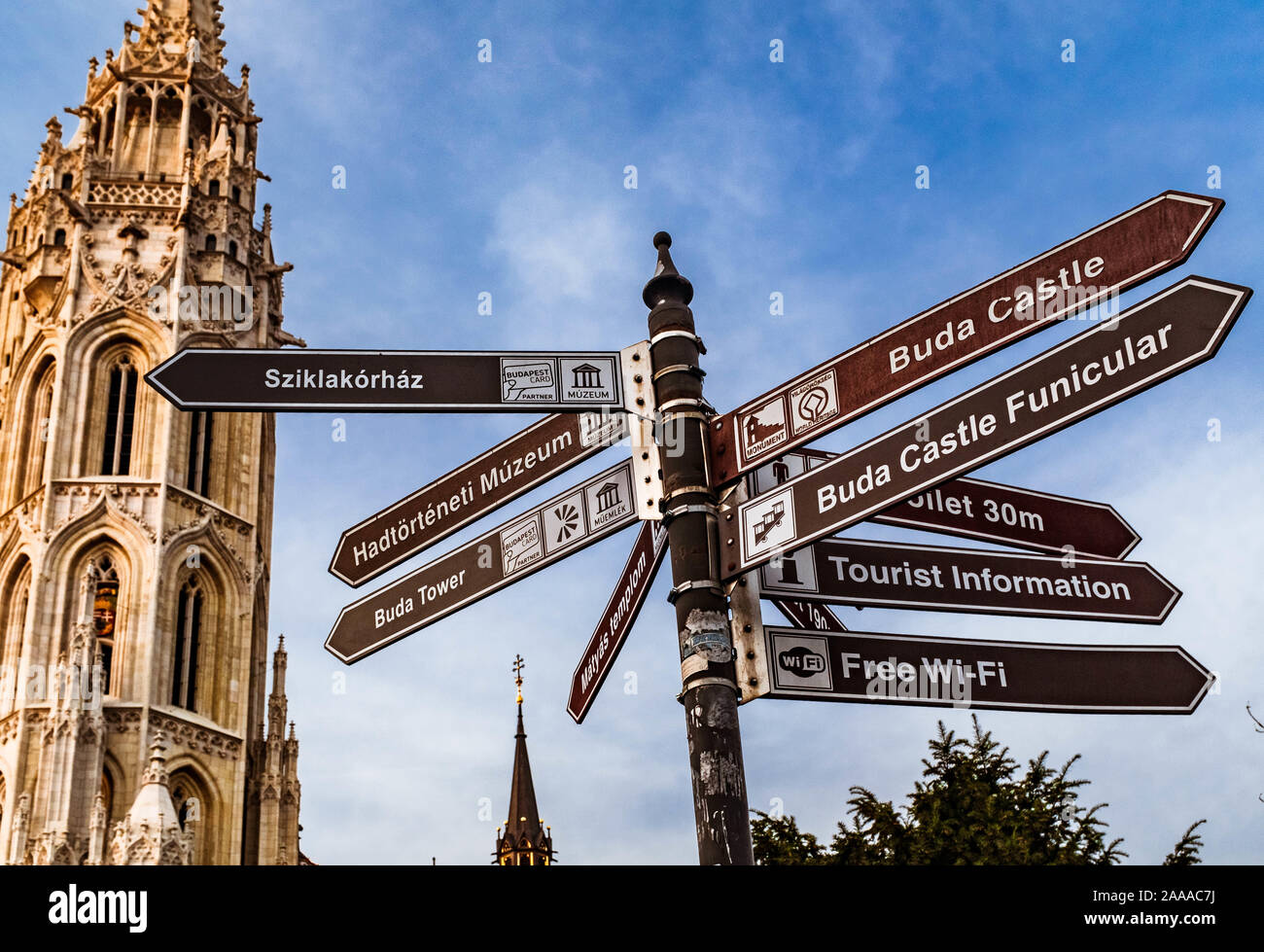 Tower of Matthias Church and direction signpost. Stock Photo