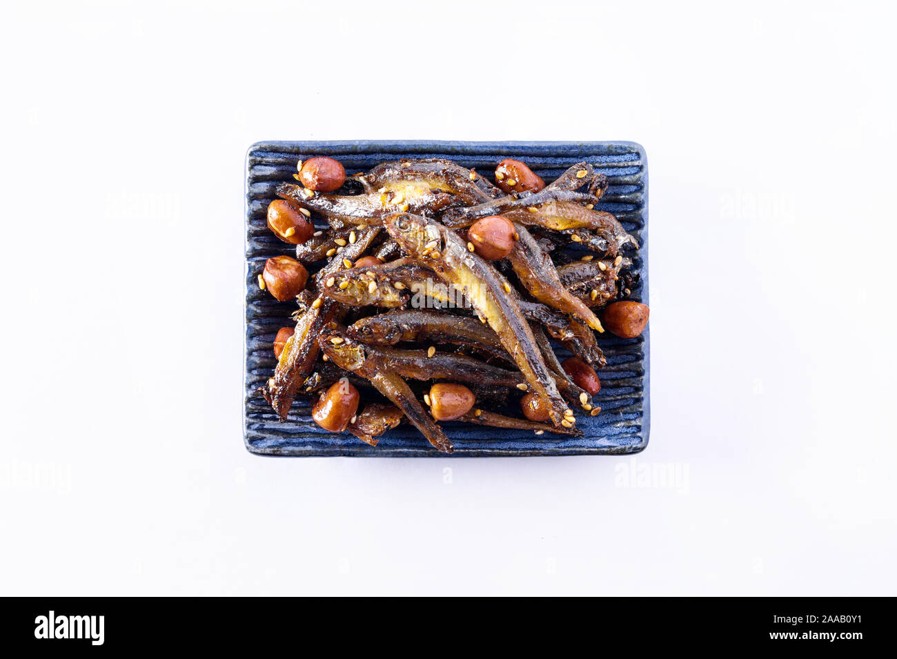 Tazukuri, candied sardines. Dried sardines lightly coated with honey, roasted sesame and peanuts. Stock Photo