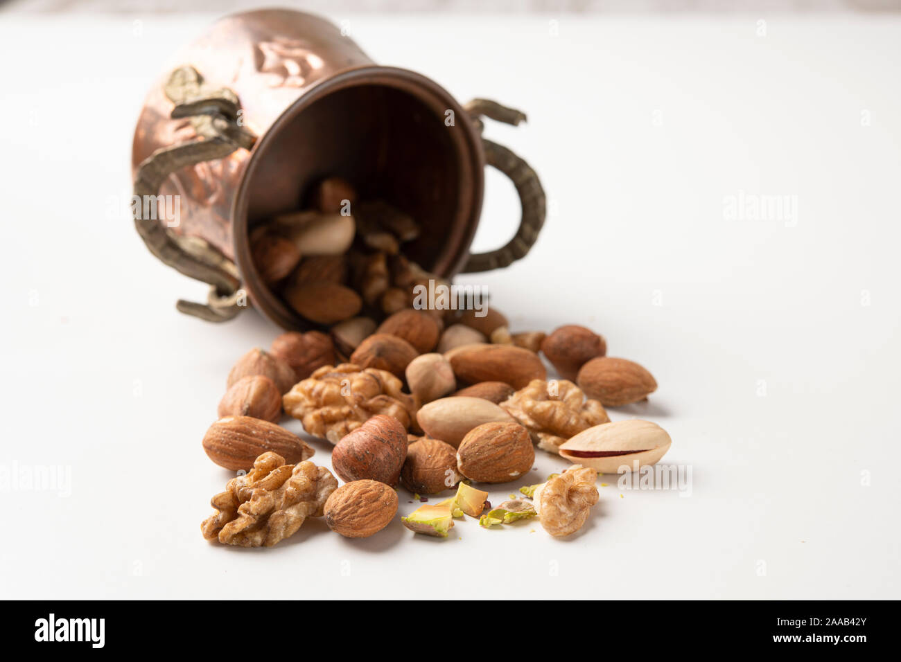 Mixed nuts in a vintage small bucket Stock Photo
