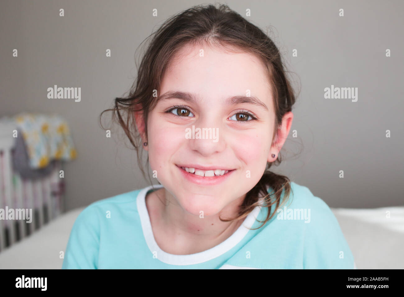 Close up Portrait of 8 Years Old Beautiful Girl, Brown Hair, Big Brown Eyes, Happy Girl Stock Photo