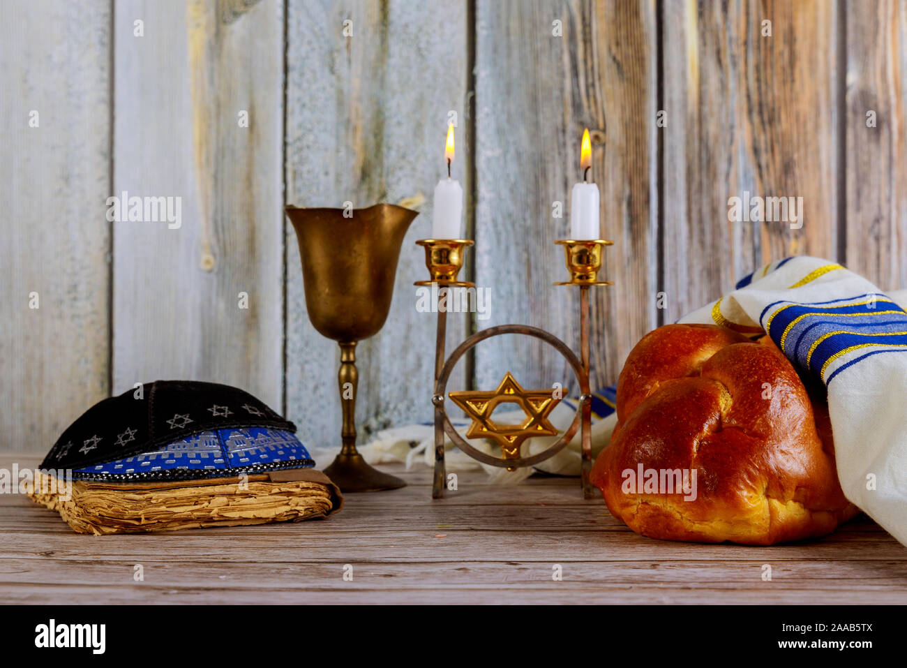 Shabbat Jewish holiday with challah bread on a candles and cup of wine ...