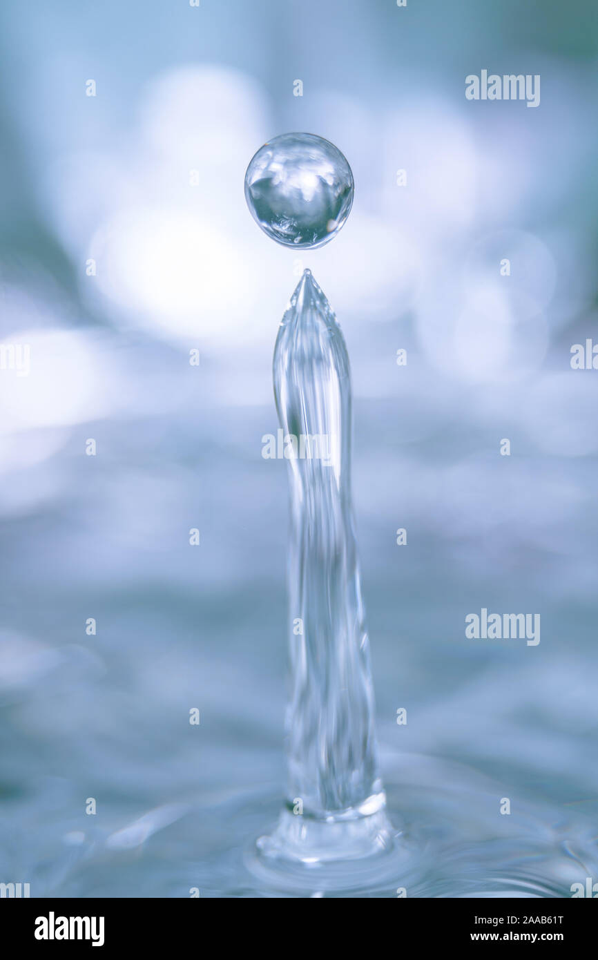 Water drop collision form metallic background Stock Photo