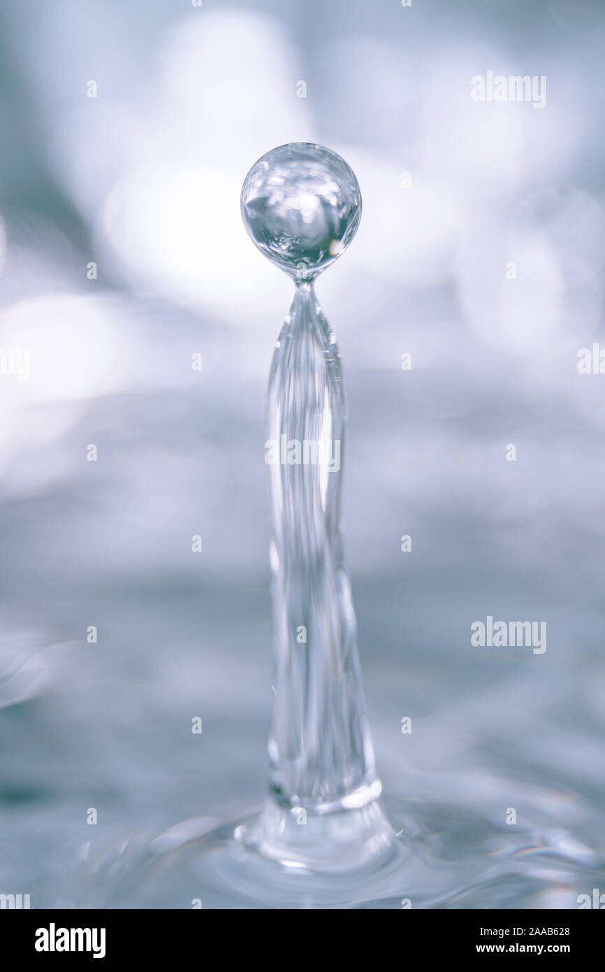 Water drop collision form metallic background Stock Photo