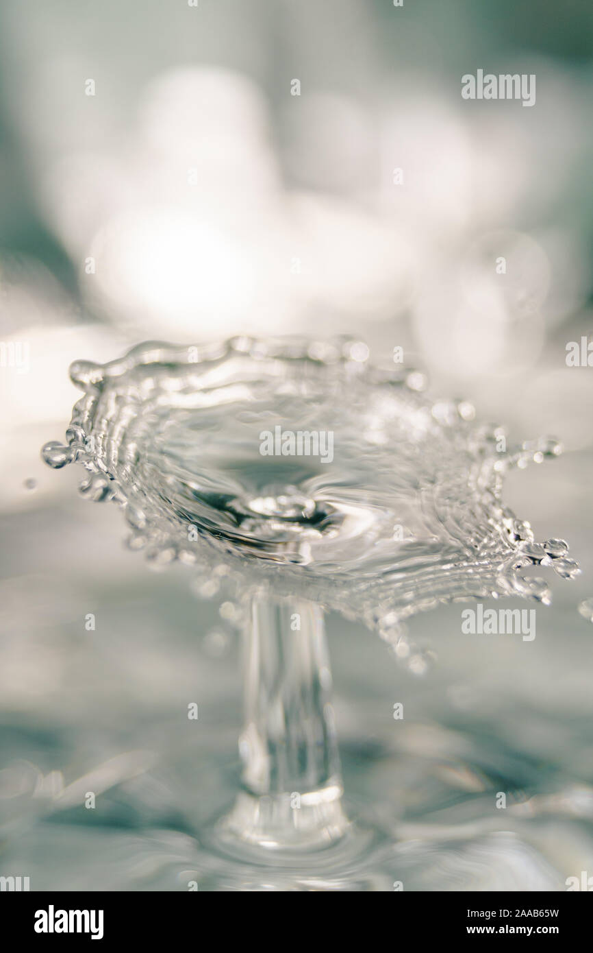 Water drop collision form metallic background Stock Photo