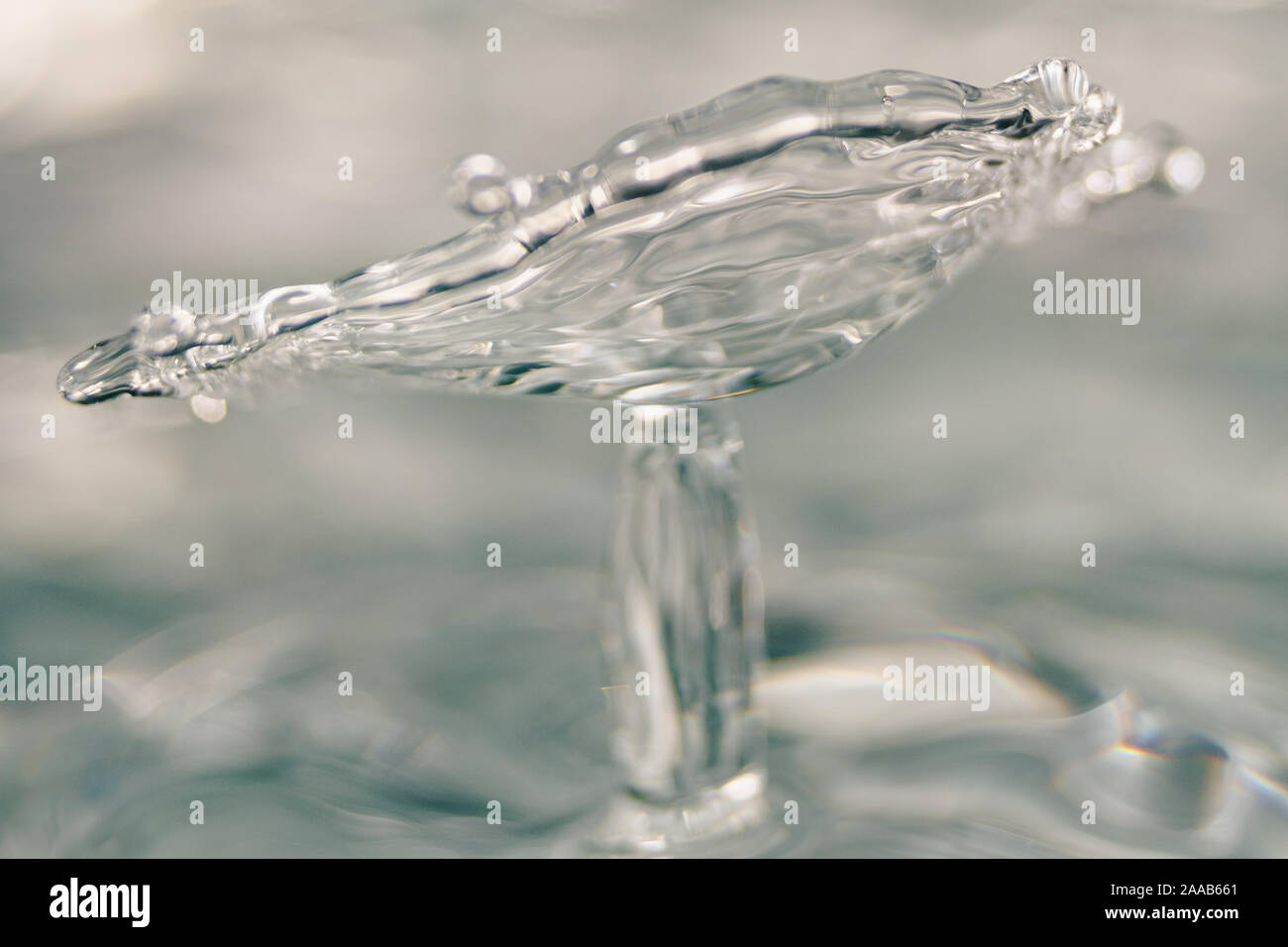 Water drop collision form metallic background Stock Photo