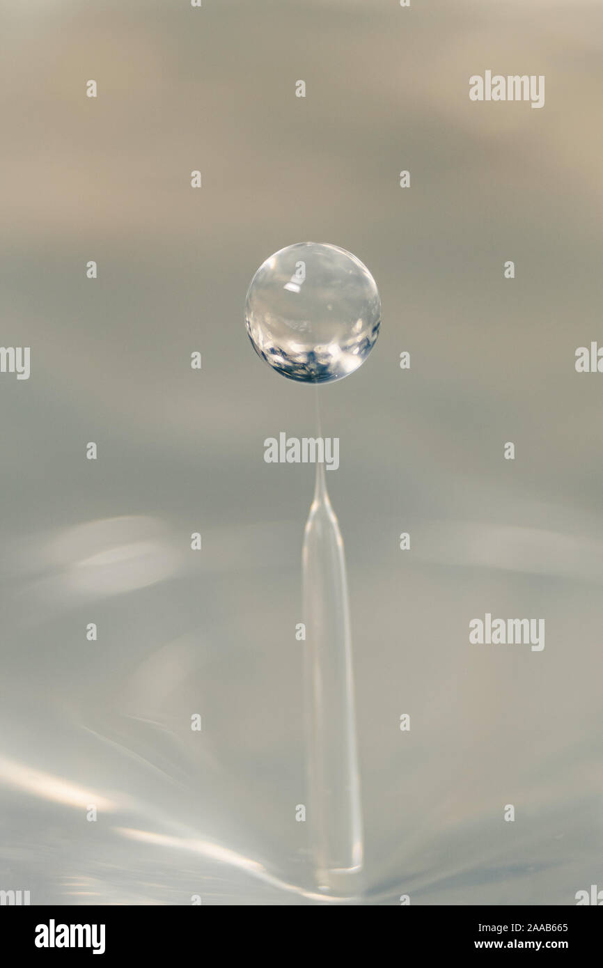 Water drop collision form metallic background Stock Photo
