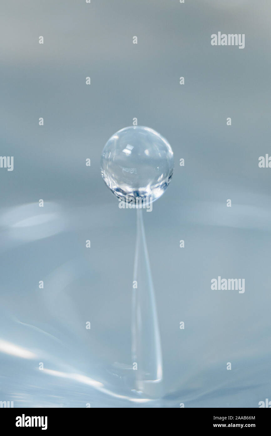 Water drop collision form metallic background Stock Photo