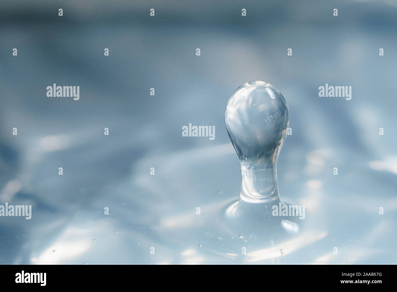 Water drop collision form metallic background Stock Photo