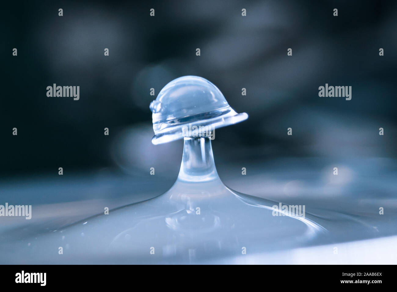 Water drop collision form metallic background Stock Photo