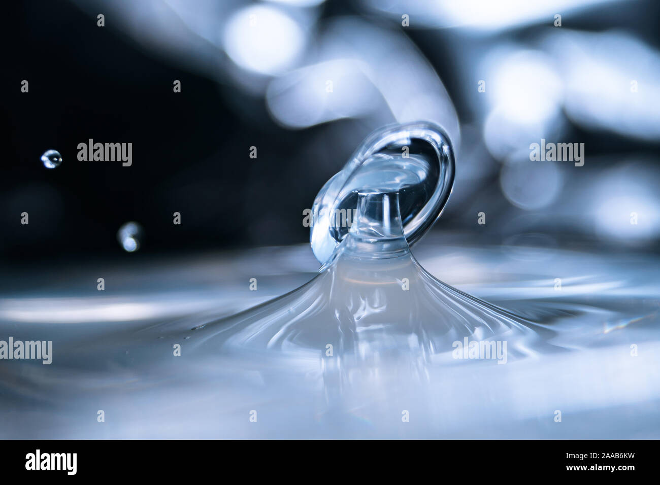 Water drop collision form metallic background Stock Photo