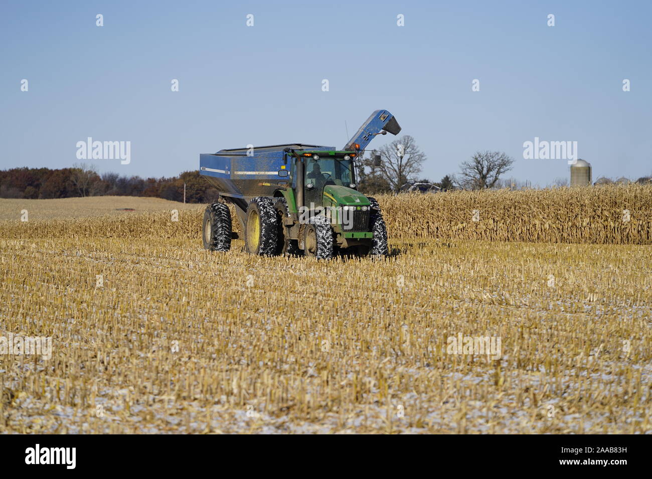 John Deere Combine being used to farm and gather animal feed stocks